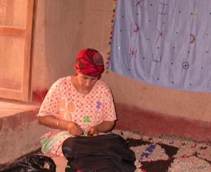 Embroider shawls in Ksar El Khorbat, south Morocco.